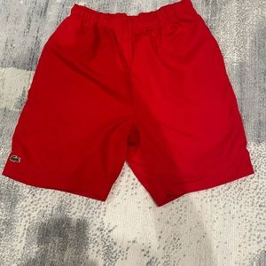Boys Lacoste shorts.
